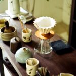 일상 속 작은 변화로 지키는 ‘정신건강’, 새로운 트렌드와 실천법 주목 Various tea ceremony utensils arranged on a wooden table.